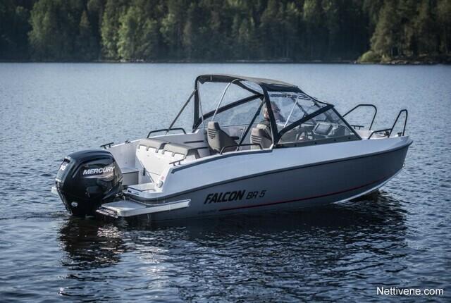 A white Falcon BR 5 boat with a Mercury outboard motor on calm water, surrounded by green forest in the background.